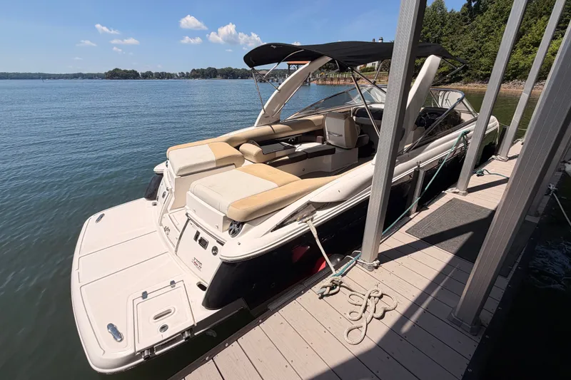 Slide: The Image of 2017 Regal 2700 ES Bowrider docked on a sunny day by the lake. - 4