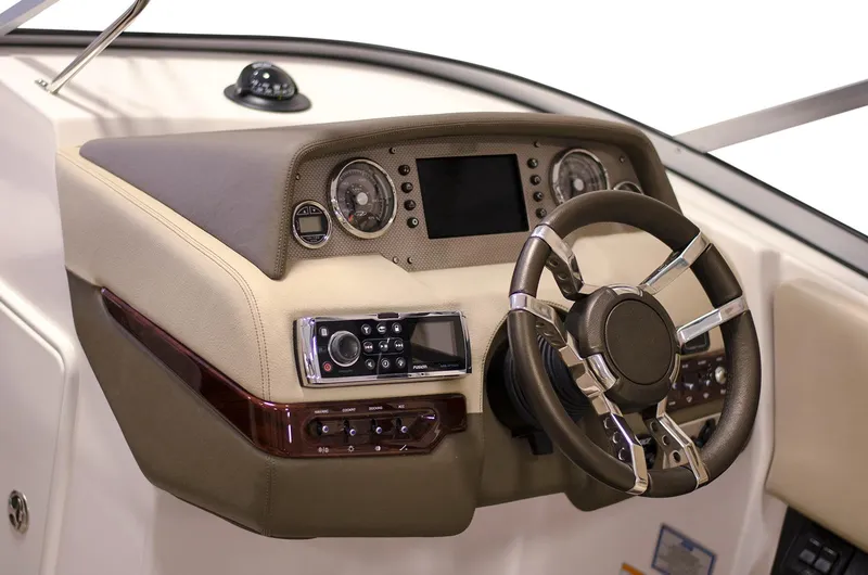 Slide: The Image of Manufacturer Provided Image: 2017 Regal 2700 ES Bowrider dashboard with steering wheel and control panel. - 19