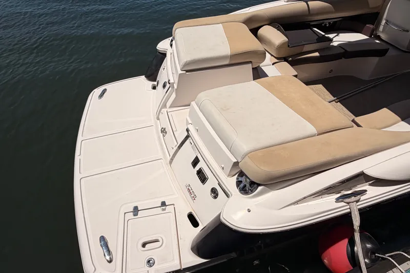 Slide: The Image of 2017 Regal 2700 ES Bowrider boat with spacious seating and swim platform. - 5