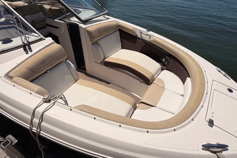 Slide: The Image of 2017 Regal 2700 ES Bowrider boat with spacious seating, docked on calm water. - 3