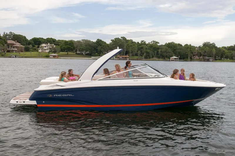 Slide: The Image of Manufacturer Provided Image: 2017 Regal 2700 ES Bowrider on a lake with passengers enjoying the ride. - 16