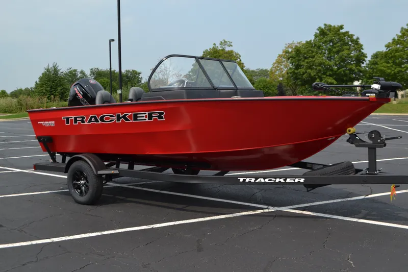 The Image of 2026 Tracker Pro Guide V-175 WT boat in a parking lot, vibrant red color. - 0