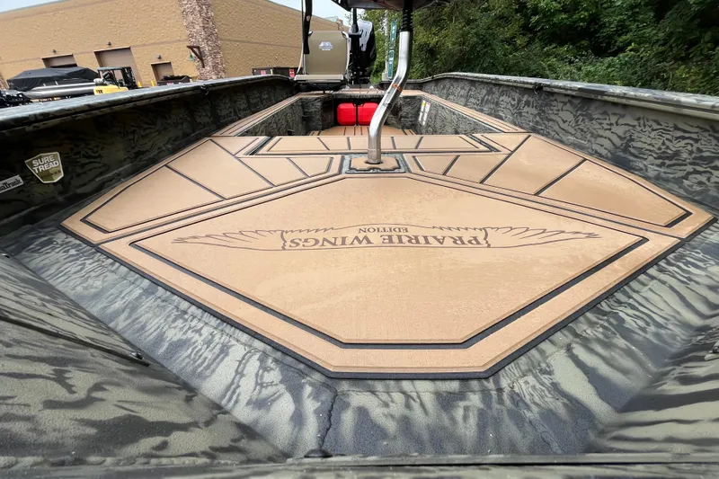 Slide: The Image of 2026 Tracker Grizzly 1650 T Prairie Wings Edition boat interior with custom flooring design. - 21
