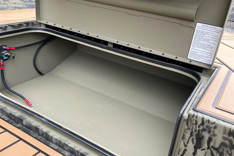 Slide: The Image of Open storage compartment of 2026 Tracker Grizzly 1650 T Prairie Wings Edition boat. - 20