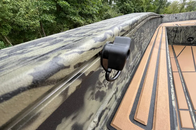 Slide: The Image of 2026 Tracker Grizzly 1650 T Prairie Wings Edition boat with camouflage design and wood accents. - 25