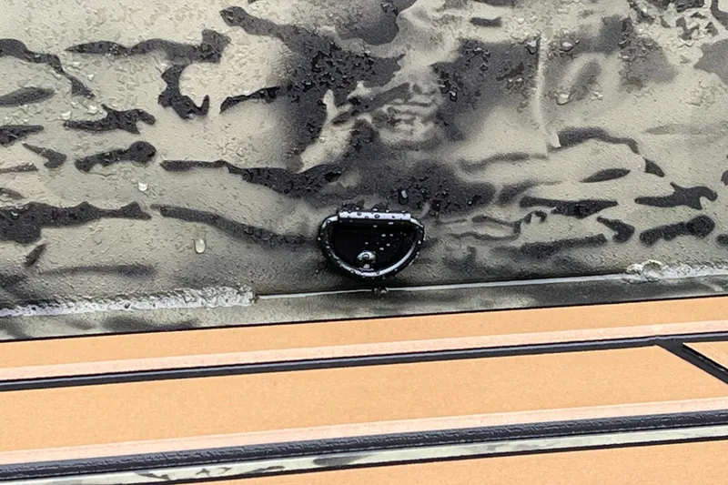 Slide: The Image of 2026 Tracker Grizzly 1650 T Prairie Wings Edition with camouflage pattern and water droplets. - 18