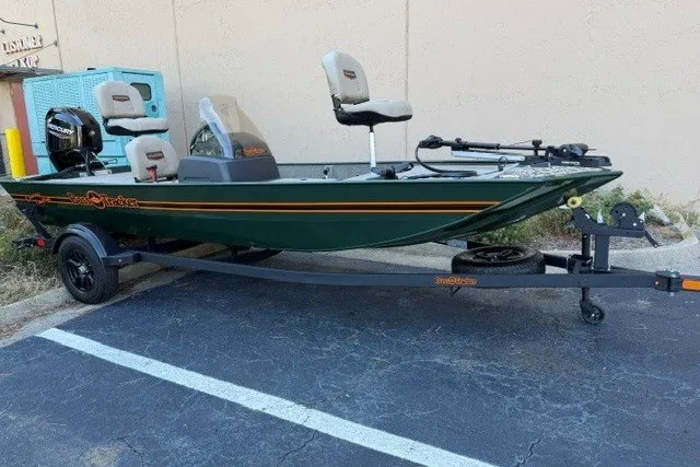 The Image of 2026 Tracker Bass Tracker Classic Limited boat on trailer in parking lot. - 0