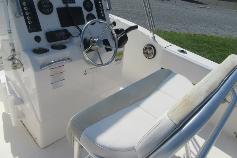 Slide: The Image of 2015 Robalo R180 Center Console boat interior with steering wheel and seating. - 21