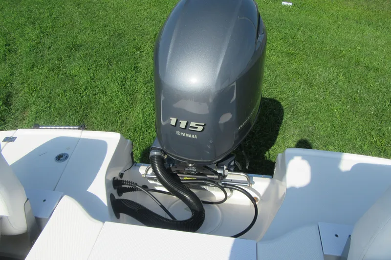 Slide: The Image of 2015 Robalo R180 Center Console with Yamaha 115 engine on grassy background. - 23