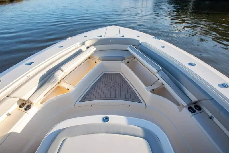 Slide: The Image of Manufacturer Provided Image: 2022 Scout 425 LXF boat bow seating area on calm water. - 26