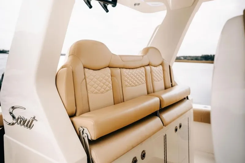 Slide: The Image of Luxurious seating on 2022 Scout 425 LXF boat, featuring tan leather upholstery and elegant design. - 35