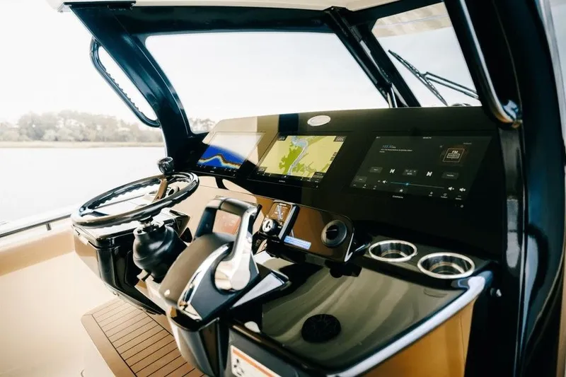 Slide: The Image of 2022 Scout 425 LXF boat dashboard with advanced navigation and control systems. - 15