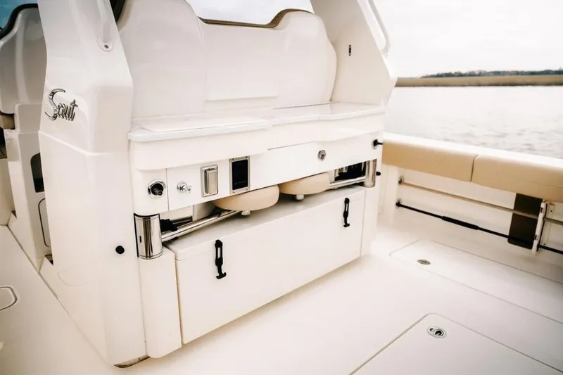 Slide: The Image of 2022 Scout 425 LXF boat interior with sleek seating and storage features. - 9