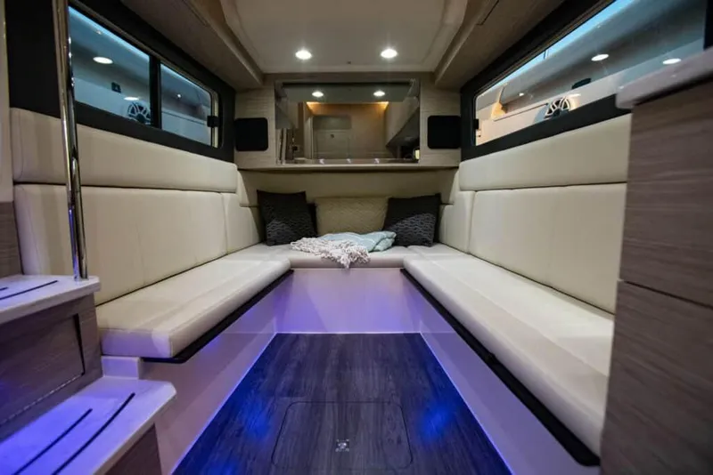 Slide: The Image of Manufacturer Provided Image: 2022 Scout 425 LXF boat interior with modern seating and ambient lighting. - 28