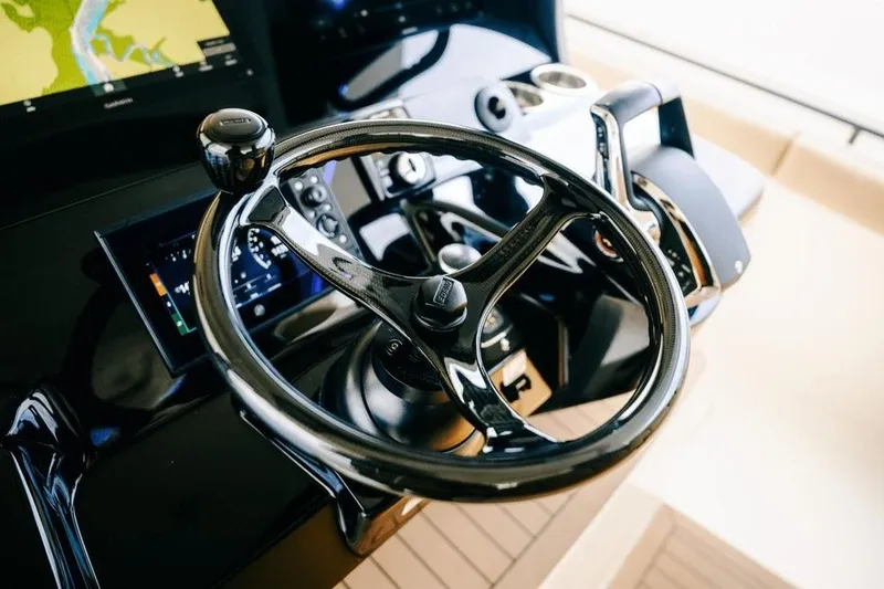 Slide: The Image of Steering wheel and controls of 2022 Scout 425 LXF boat cockpit. - 20