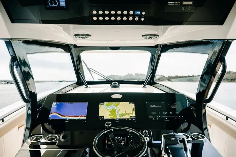 Slide: The Image of Cockpit view of 2022 Scout 425 LXF boat with advanced navigation displays. - 4