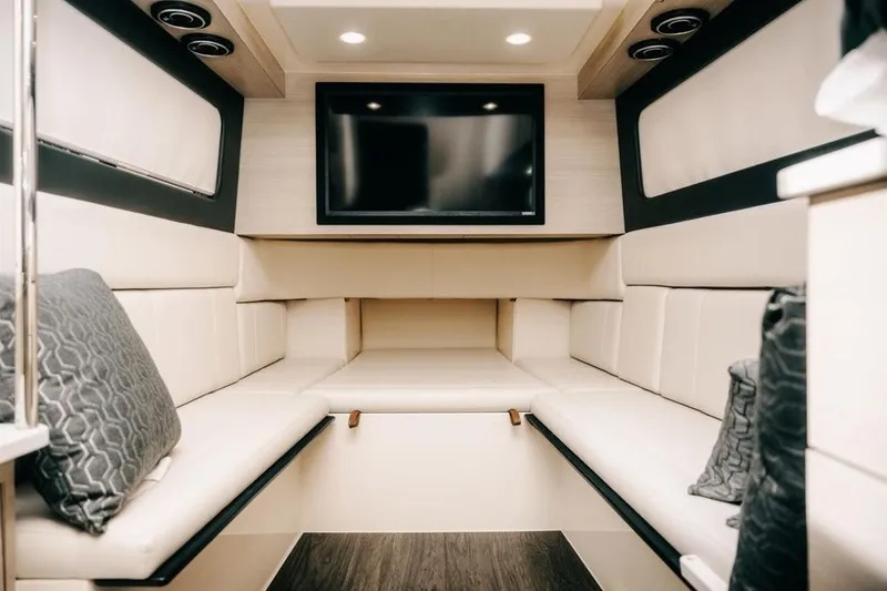 Slide: The Image of Luxurious interior of 2022 Scout 425 LXF boat with plush seating and TV. - 27