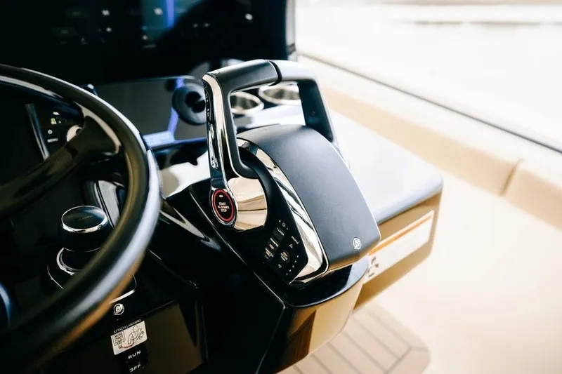 Slide: The Image of Helm controls of 2022 Scout 425 LXF boat, featuring sleek design and advanced technology. - 23
