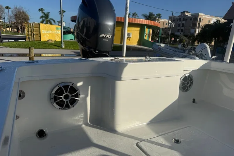 Slide: The Image of 2021 Pair Customs 21 Center Console MV boat with Yamaha 200 engine, docked in sunny marina. - 13