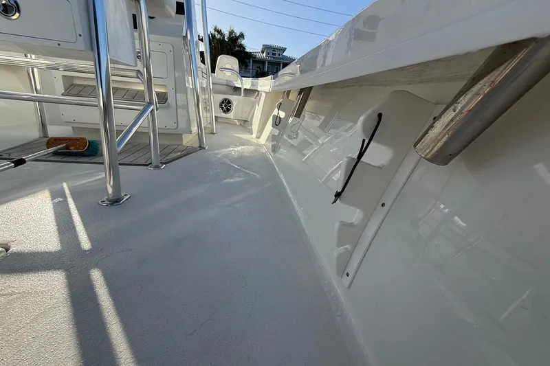 Slide: The Image of Interior view of 2021 Pair Customs 21 Center Console MV boat, showcasing sleek design and stainless steel features. - 29