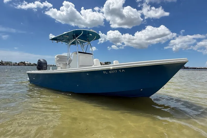 The Image of 2021 Pair Customs 21 Center Console MV boat on clear water under blue sky. - 0