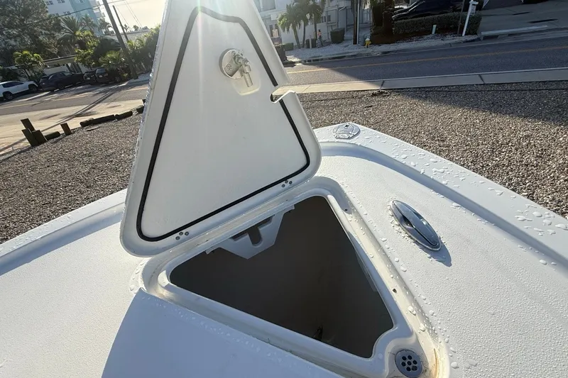 Slide: The Image of Open storage compartment on 2021 Pair Customs 21 Center Console MV boat. - 27