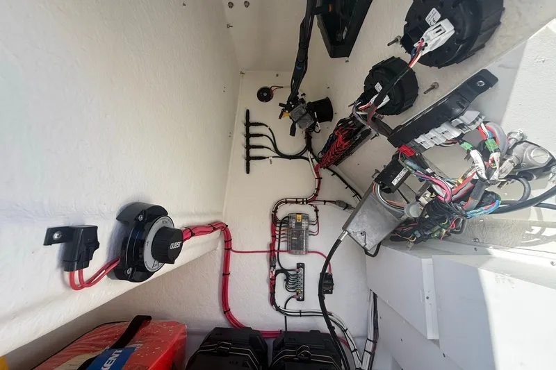Slide: The Image of Electrical wiring setup inside a 2021 Pair Customs 21 Center Console MV boat. - 21