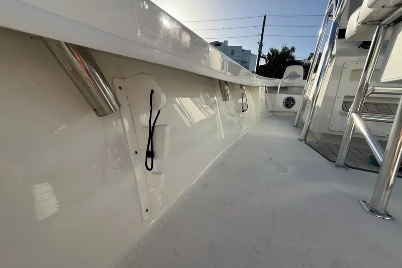 Slide: The Image of 2021 Pair Customs 21 Center Console MV boat interior with stainless steel fixtures. - 28
