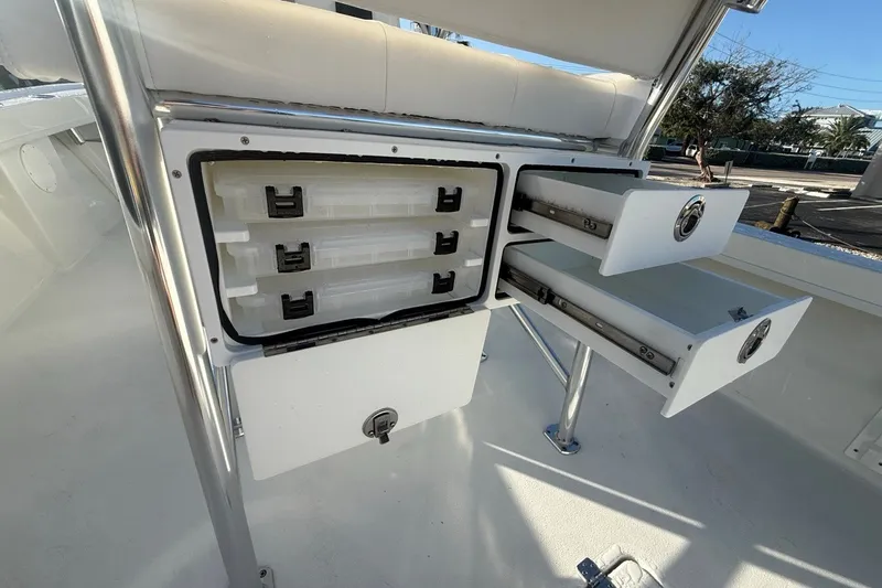 Slide: The Image of 2021 Pair Customs 21 Center Console MV with open storage compartments and drawers. - 20
