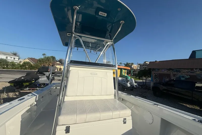 Slide: The Image of 2021 Pair Customs 21 Center Console MV boat with T-top, parked outdoors. - 22