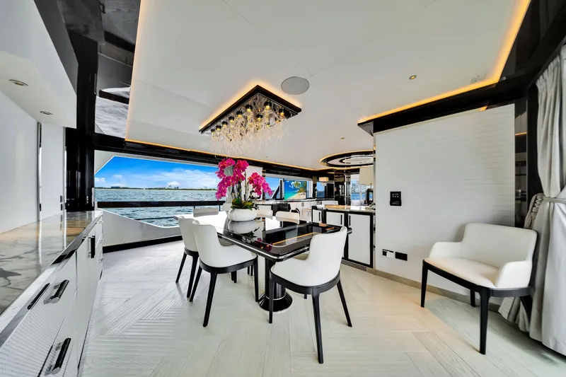 Slide: The Image of Luxurious interior of 2021 Sirena 88 yacht with elegant dining area and ocean view. - 59