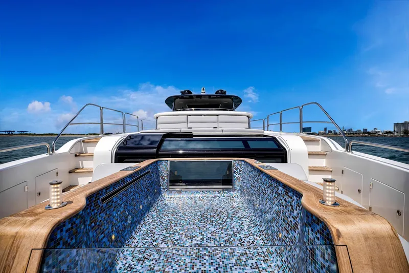 Slide: The Image of Luxurious 2021 Sirena 88 yacht with mosaic-tiled deck and stunning ocean view. - 37