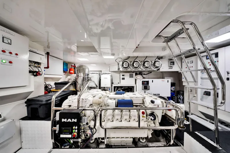 Slide: The Image of Engine room of 2021 Sirena 88 yacht, featuring advanced machinery and control panels. - 142