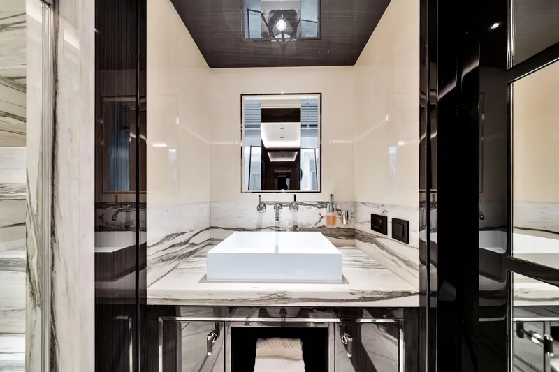 Slide: The Image of Luxurious bathroom in 2021 Sirena 88 yacht with marble countertops and modern fixtures. - 114