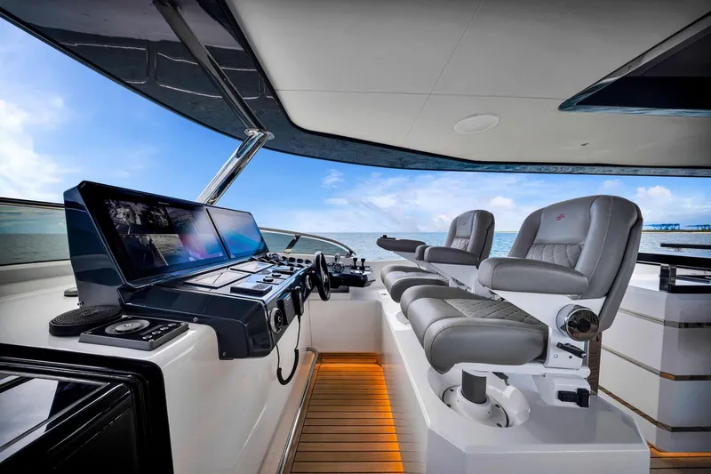 Slide: The Image of Luxurious helm of 2021 Sirena 88 yacht with modern controls and plush seating. - 25