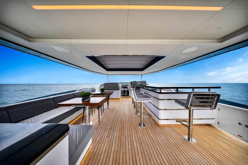 Slide: The Image of Luxurious 2021 Sirena 88 yacht deck with elegant seating and ocean view. - 15