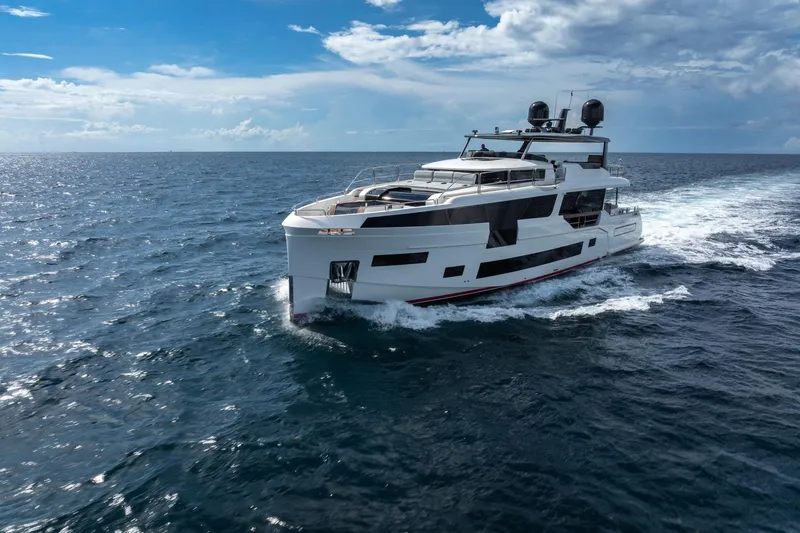 Slide: The Image of Luxury Sirena 88 yacht cruising on open sea under clear blue sky, 2021 model. - 29
