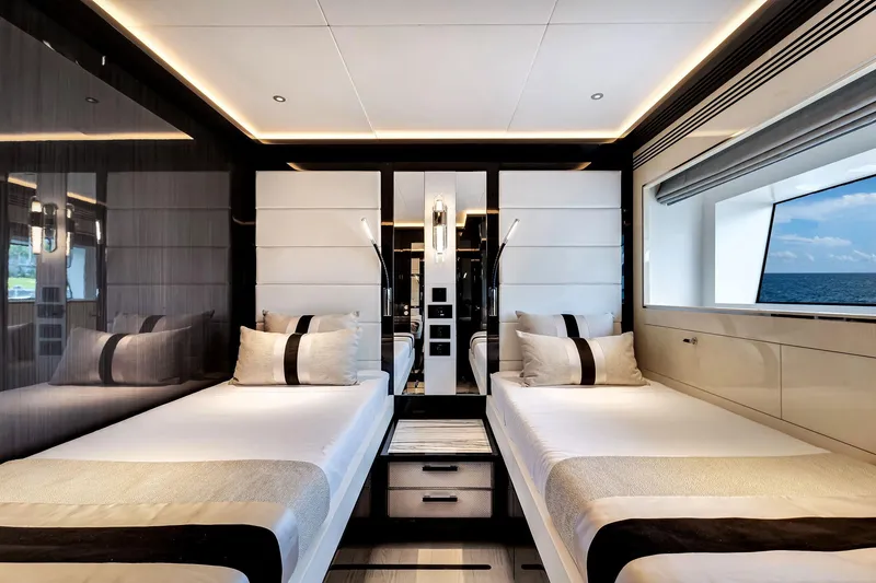 Slide: The Image of Luxurious Sirena 88 yacht interior, 2021 model, featuring twin beds and ocean view window. - 118