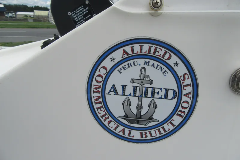 Slide: The Image of Allied 17 Sportsman 2015 boat logo, Peru, Maine, featuring anchor design. - 23