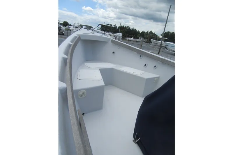 Slide: The Image of 2015 Allied 17 Sportsman boat interior with seating and storage compartments. - 6