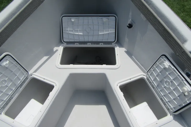 Slide: The Image of Open storage compartments on a 2015 Allied 17 Sportsman boat deck. - 9