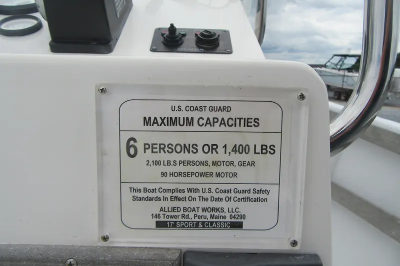 Slide: The Image of U.S. Coast Guard capacity plate on 2015 Allied 17 Sportsman boat, 6 persons or 1,400 lbs. - 24