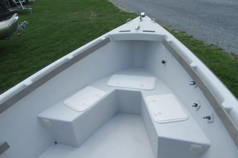 Slide: The Image of 2015 Allied 17 Sportsman boat interior with storage compartments and seating. - 8
