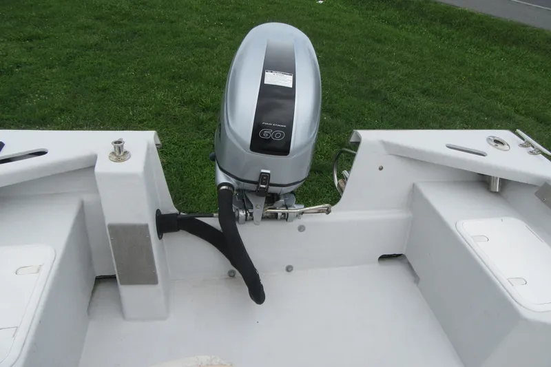 Slide: The Image of 2015 Allied 17 Sportsman boat with a 60 HP outboard motor, on grassy background. - 21