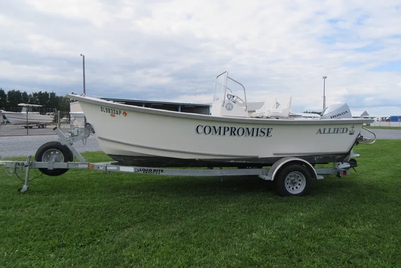 Slide: The Image of 2015 Allied 17 Sportsman boat on trailer, labeled "COMPROMISE," with Honda motor. - 3
