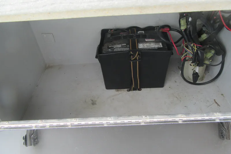 Slide: The Image of Battery compartment of a 2015 Allied 17 Sportsman boat with wiring. - 16