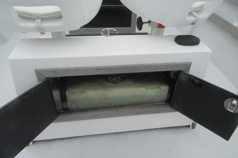 Slide: The Image of Open storage compartment in 2015 Allied 17 Sportsman boat, revealing internal tank. - 22