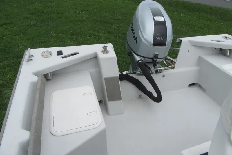 Slide: The Image of 2015 Allied 17 Sportsman boat with Honda outboard motor, on grassy background. - 20