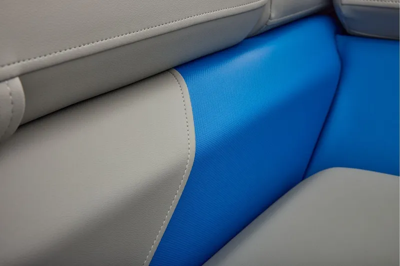 Slide: The Image of Manufacturer Provided Image: 2026 Sun Tracker Party Barge 22 RF XP3 interior seating detail, featuring blue and gray upholstery. - 26