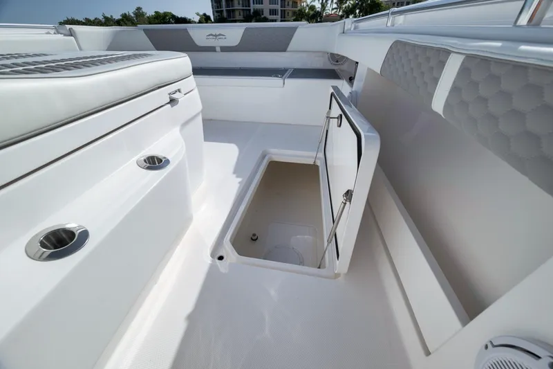 Slide: The Image of 2025 Invincible 35 Catamaran interior with open storage compartment, sleek design, and modern features. - 22